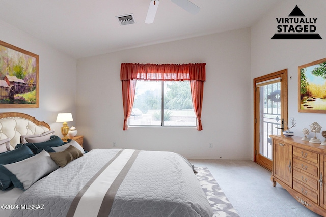 bedroom featuring ceiling fan, light carpet, and vaulted ceiling