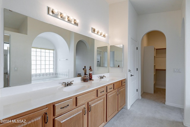 bathroom with vanity and a bathtub