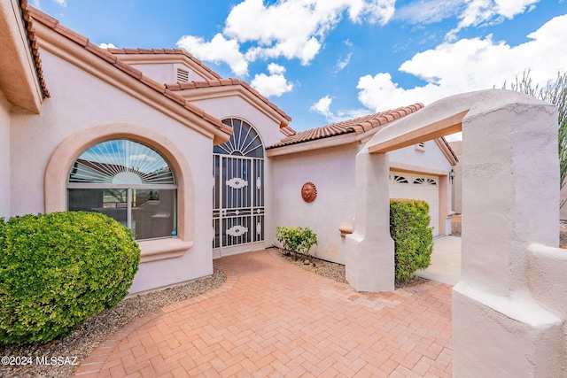 doorway to property featuring a garage