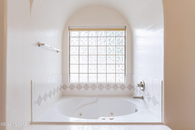 bathroom featuring tiled bath