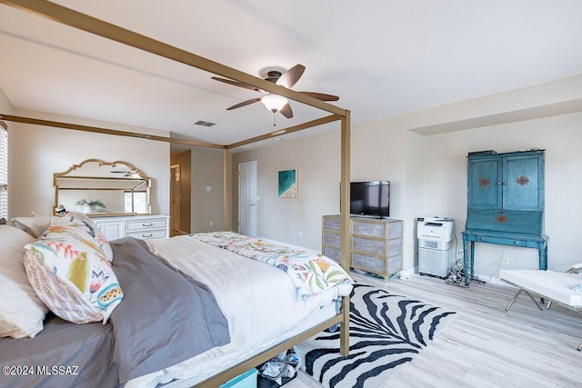 bedroom with ceiling fan and light hardwood / wood-style flooring