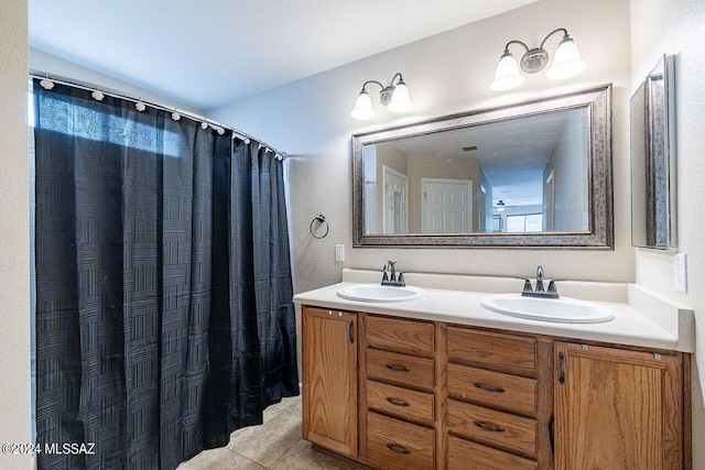 bathroom with tile patterned flooring and vanity