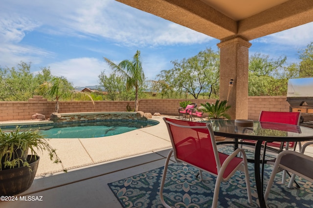 view of swimming pool with a patio