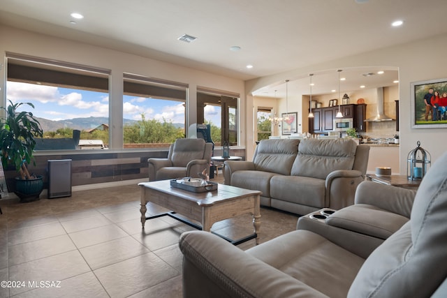 tiled living room featuring a mountain view