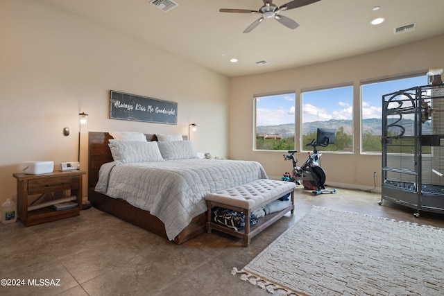 tiled bedroom with ceiling fan