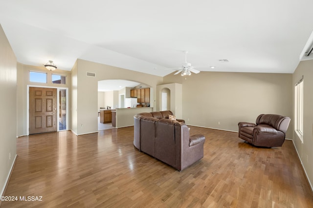 living room featuring ceiling fan, plenty of natural light, and light hardwood / wood-style flooring