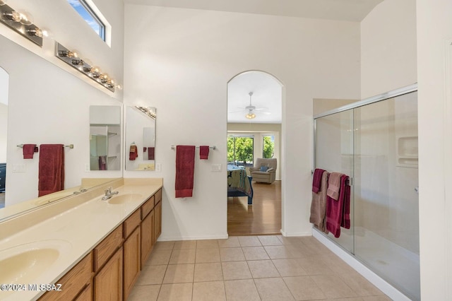 bathroom with vanity, a shower with door, tile patterned floors, and ceiling fan