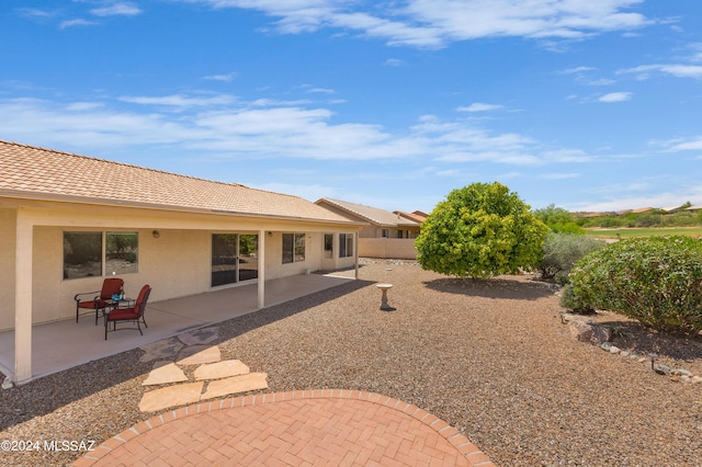 rear view of property with a patio area