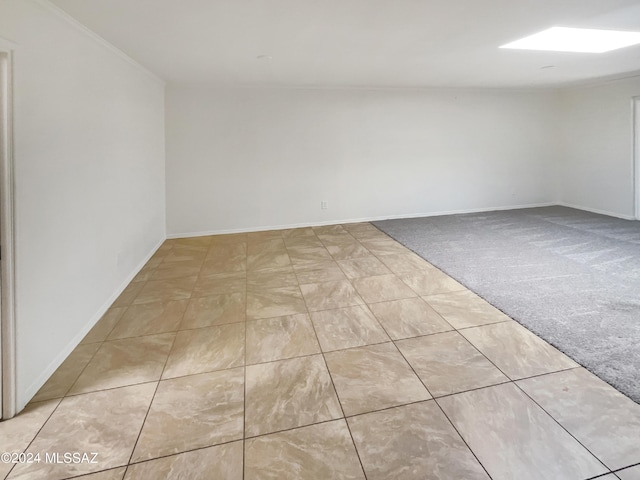 unfurnished room with light carpet