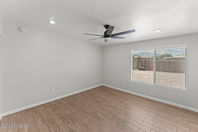 unfurnished room featuring ceiling fan and light hardwood / wood-style flooring