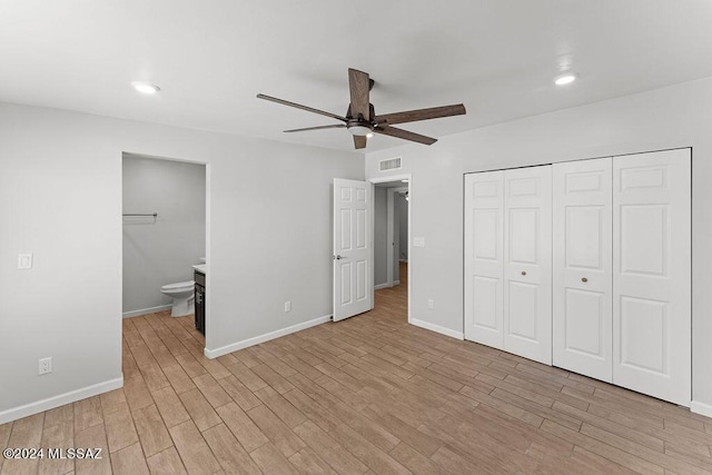 unfurnished bedroom with connected bathroom, ceiling fan, a closet, and light hardwood / wood-style floors