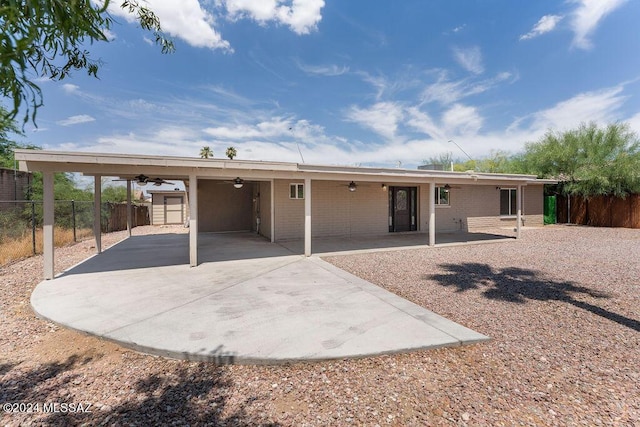 rear view of house featuring a patio area and ceiling fan