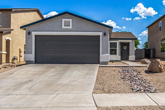 1097 W Camino Luna Llena, Sahuarita, AZ 85629 - ranch-style home with stucco siding, a garage, and concrete driveway