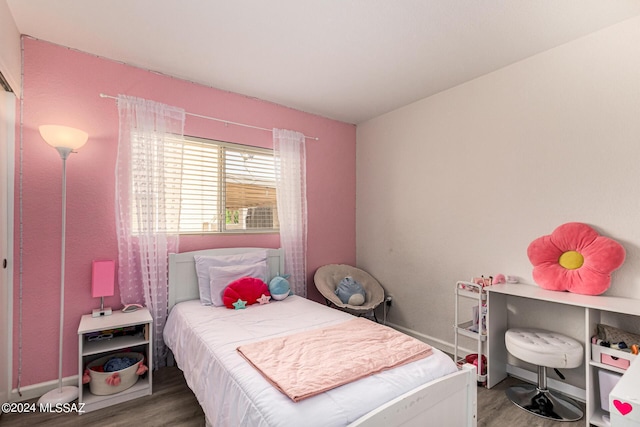 bedroom featuring wood-type flooring