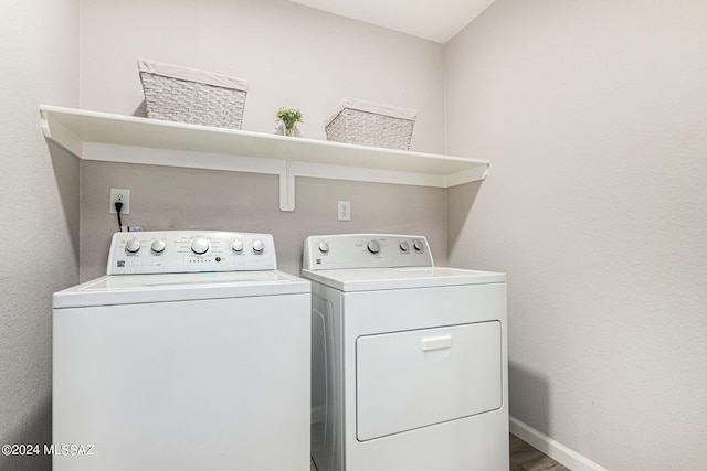 washroom featuring separate washer and dryer and hardwood / wood-style floors