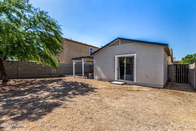 1097 W Camino Luna Llena, Sahuarita, AZ 85629 - rear view of property with stucco siding and a fenced backyard