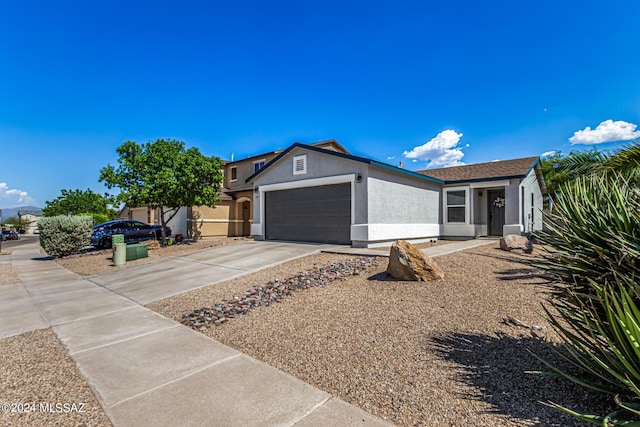 single story home with a garage