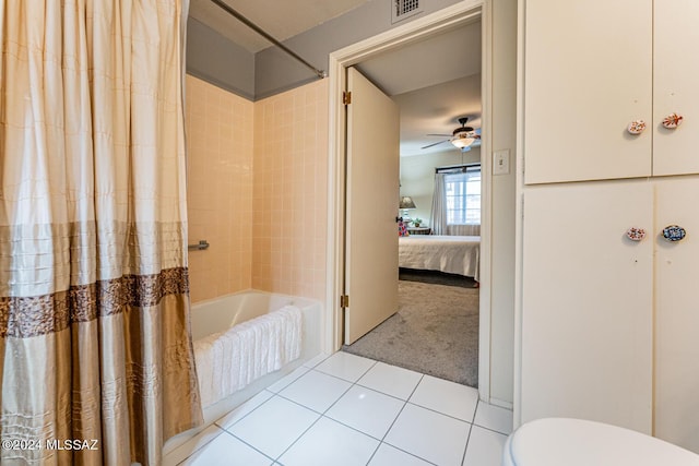 bathroom featuring ceiling fan, tile patterned flooring, shower / bathtub combination with curtain, and toilet