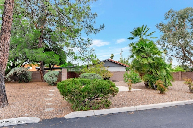 view of property hidden behind natural elements