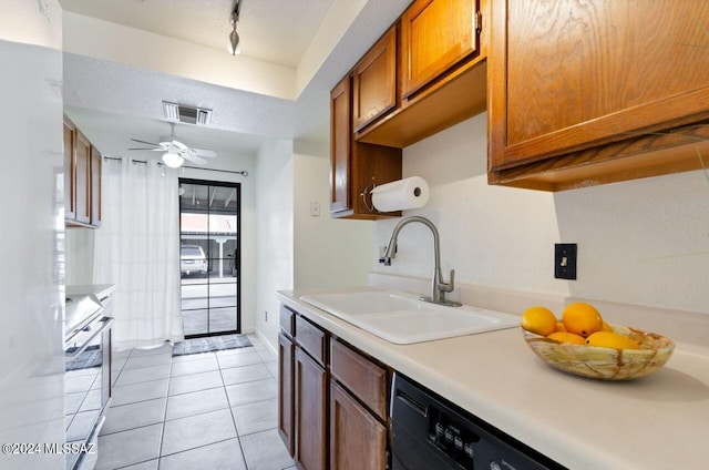 kitchen featuring stove, ceiling fan, sink, dishwasher, and light tile patterned flooring