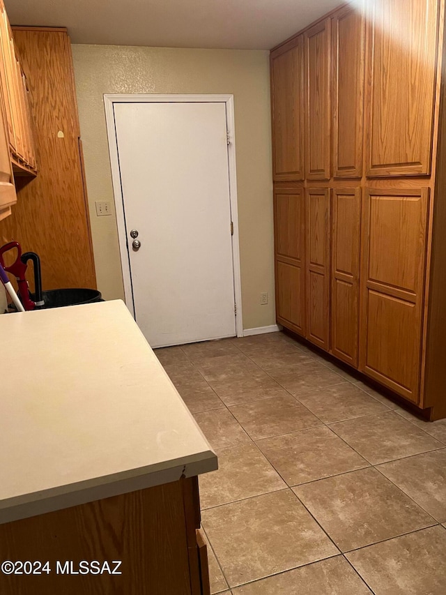 kitchen with light tile patterned floors