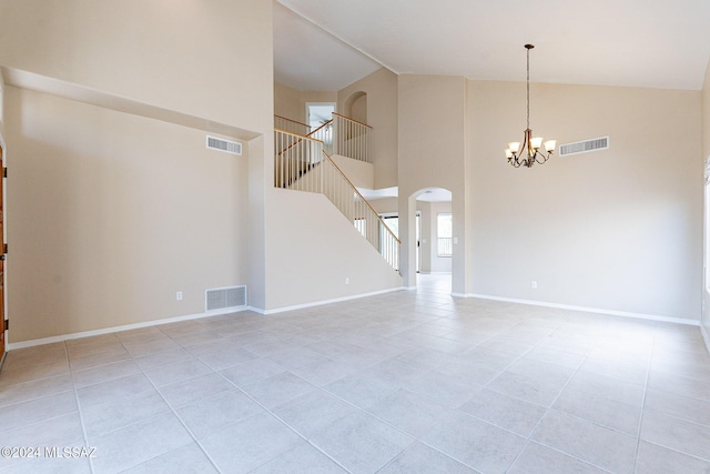 interior space with stairway, a notable chandelier, baseboards, and visible vents