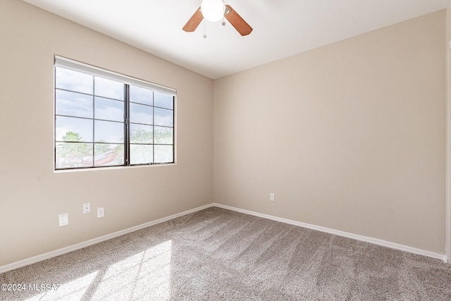 unfurnished room featuring ceiling fan, baseboards, and carpet floors