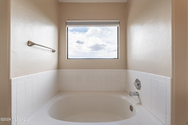 bathroom with a garden tub