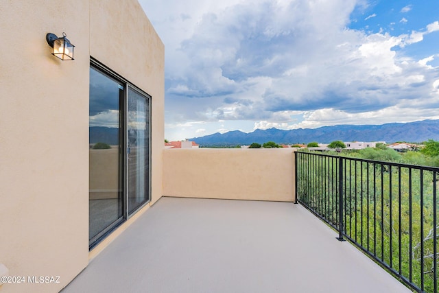 balcony featuring a mountain view