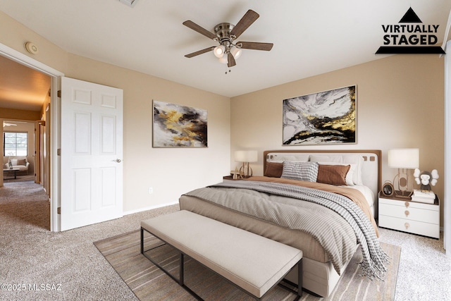 carpeted bedroom with baseboards and ceiling fan