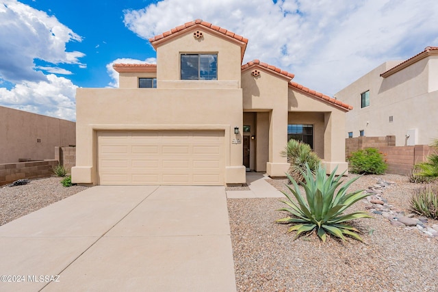 view of front facade with fence, stucco siding, concrete driveway, a garage, and a tiled roof