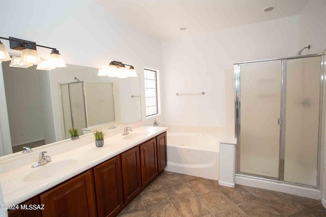 bathroom with vanity and separate shower and tub