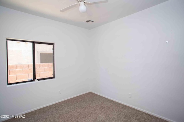 empty room with ceiling fan, carpet floors, and a healthy amount of sunlight