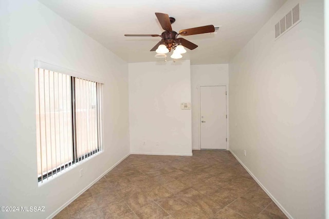 unfurnished room with ceiling fan