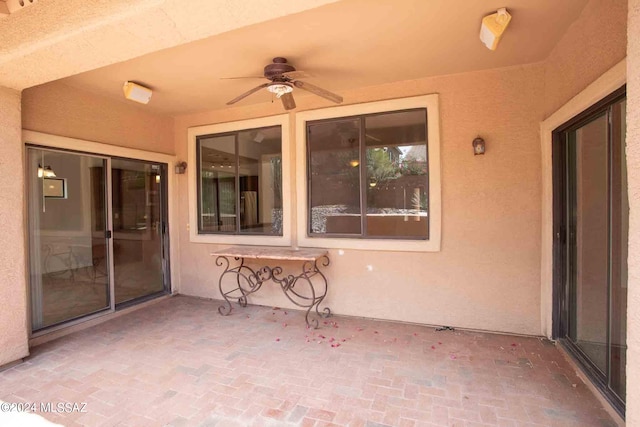 view of patio featuring ceiling fan