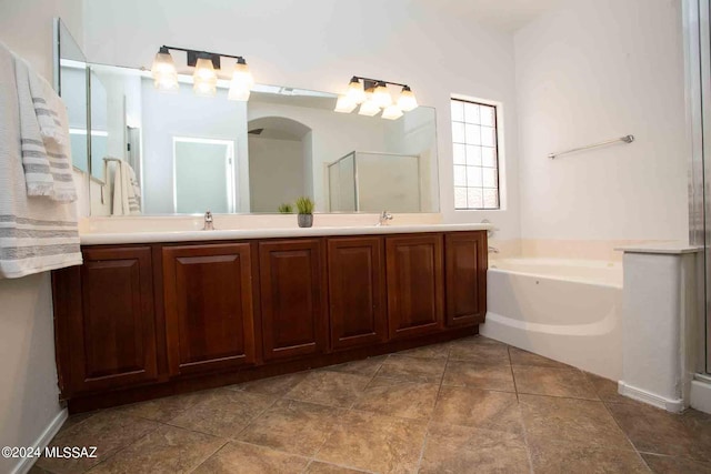 bathroom featuring vanity and separate shower and tub