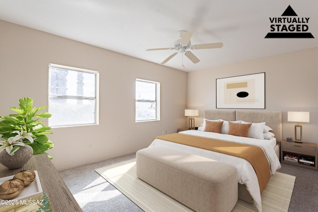 bedroom featuring ceiling fan and carpet floors