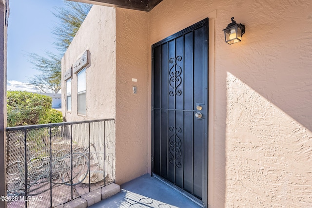 entrance to property featuring a balcony