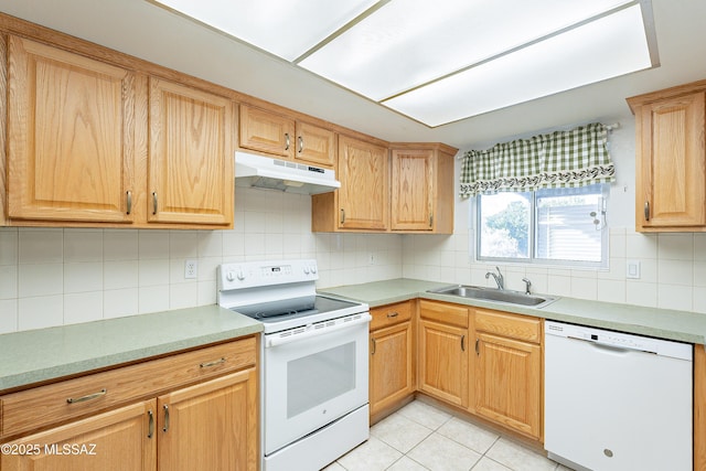 kitchen with light tile patterned flooring, white appliances, sink, and decorative backsplash