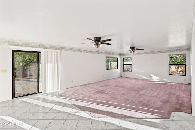 interior space featuring ceiling fan and a healthy amount of sunlight