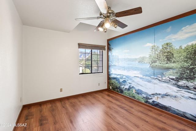 empty room featuring hardwood / wood-style flooring and ceiling fan