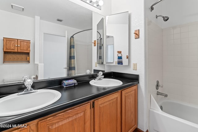 bathroom featuring shower / bath combo with shower curtain and vanity