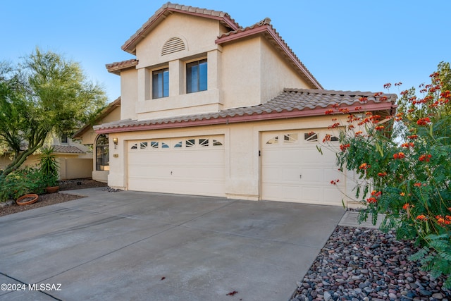 mediterranean / spanish-style house featuring a garage