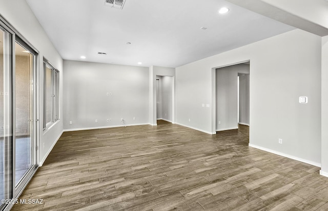 unfurnished room featuring hardwood / wood-style floors