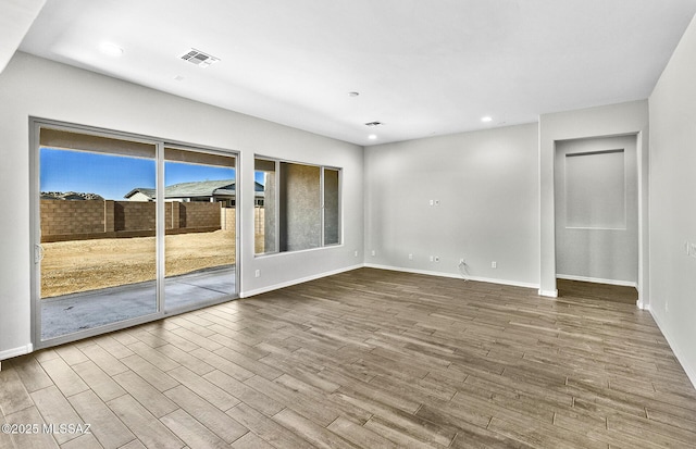 unfurnished room featuring wood-type flooring