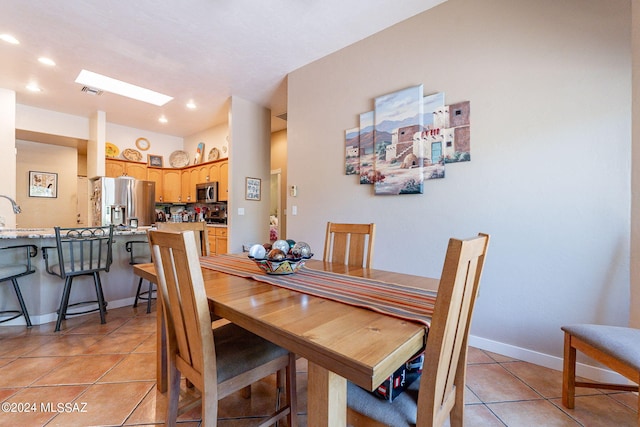 dining space featuring light tile patterned floors, baseboards, visible vents, and recessed lighting