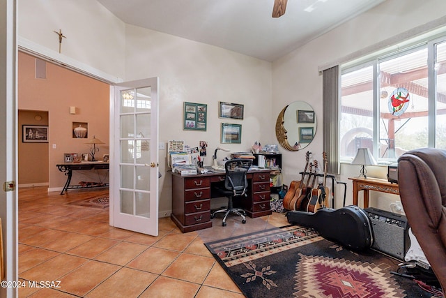 office featuring french doors, ceiling fan, baseboards, and light tile patterned floors