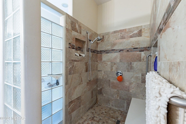 full bathroom featuring a tile shower