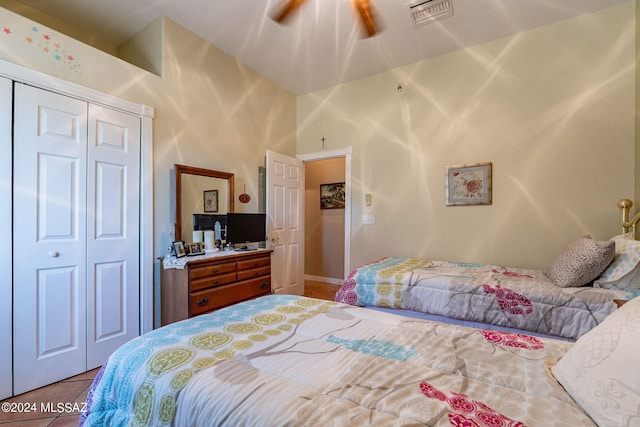 bedroom featuring a closet, visible vents, and tile patterned floors