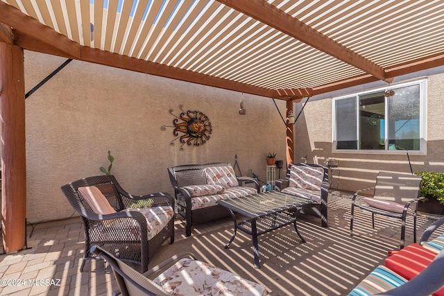 view of patio with outdoor lounge area and a pergola